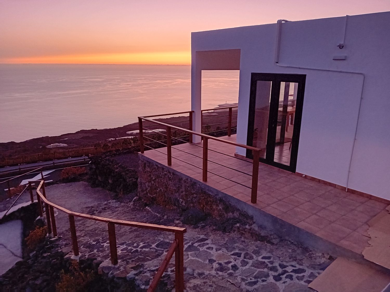 House main entrance with sunset